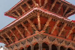 Temple with young people on steps to temple with blue sky in background, Durbar Square, Kathamandu, Nepal. March 2014