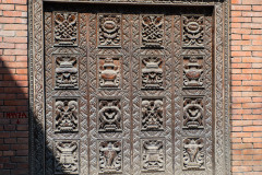 Carved wooden door on Hanuman Dhoka old Royal Palace, before earthquake in April 2015. Durbar Square in Kathmandu, Nepal March 2014