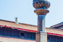 Garuda Statue with pigeons sitting on top of statue, before earthquake in 2015. Durbar Square, Kathmandu, Nepal, March 2014